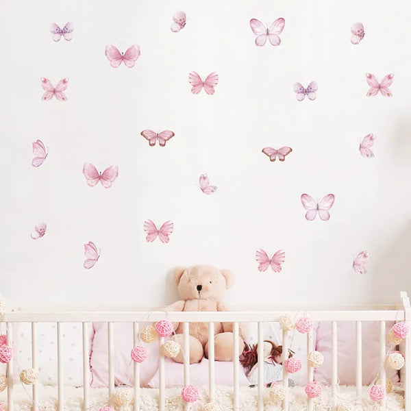 Pink butterfly wall stickers on the wall of a nursery