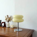 Stylish retro cream macaron style lamp on display on table